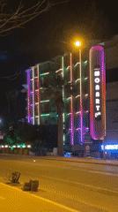 Evening scenes captured around illuminated MONART building in Alanya