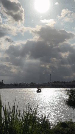Cai River boats and stormy light, Nha Trang morning