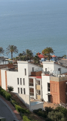 Coastal buildings filmed from elevated view in Orpesa, Spain