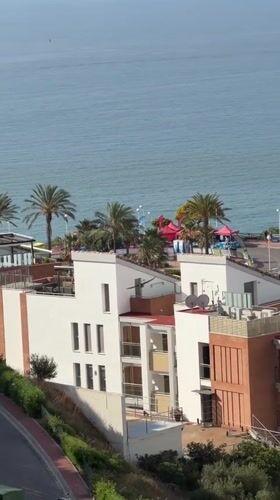 Coastal buildings filmed from elevated view in Orpesa, Spain