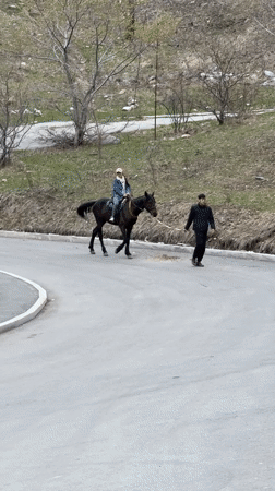 Horseback riders spotted on mountain road near Almaty
