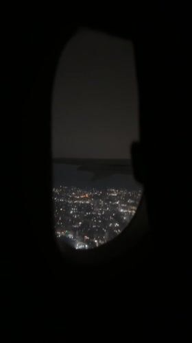 Passenger captures nighttime city view from airplane over Armenia