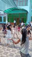 Children's outdoor exercise class at a Fergana City courtyard