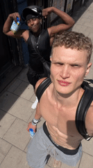Shirtless man walks London streets, takes mirror selfies