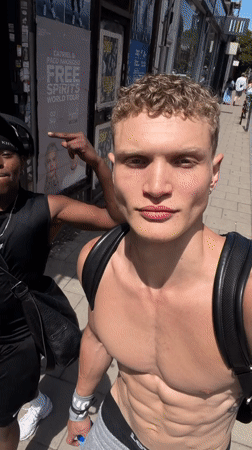 Shirtless man walks London streets, takes mirror selfies