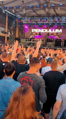 Pendulum live on stage before a packed outdoor crowd in Riga