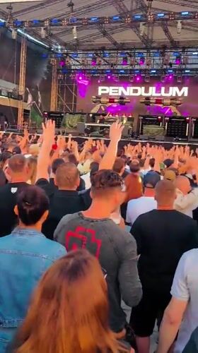 Pendulum live on stage before a packed outdoor crowd in Riga