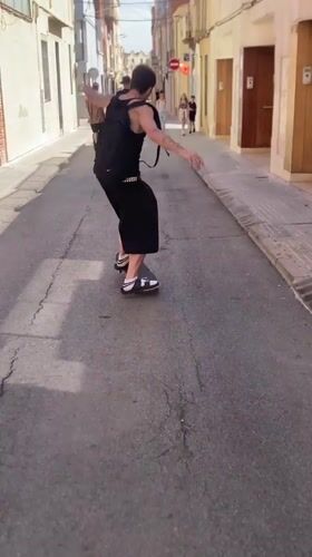 Skateboarders perform tricks on rails and ramps in Terrassa