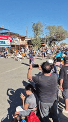 Colorful street parade with costumed dancers in Pozo Almonte