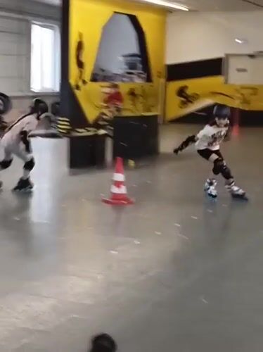 Children practice roller skating at indoor facility in Novosibirsk