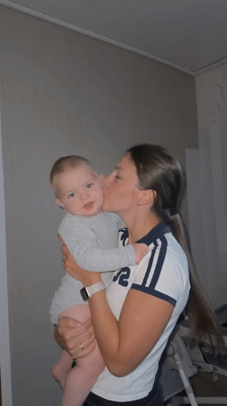 Mother documents tender baby moments during evening outing in Fredenbeck