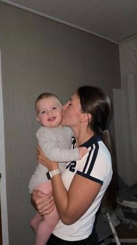 Mother documents tender baby moments during evening outing in Fredenbeck