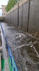 Tugboat operations documented in industrial canal system