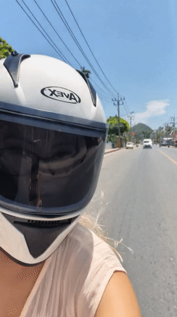 Motorcycle ride through Ko Samui streets on a clear morning