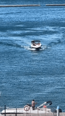 Routine boat traffic observed at Tivat marina during sunny morning