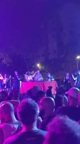 Late-night street scene and outdoor gathering in Barcelona