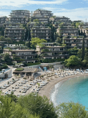 Tourist documents luxury Budva resort visit with selfies, aerial views