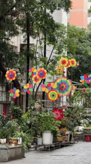 Colorful pinwheels spin in Tianhe District apartment courtyard