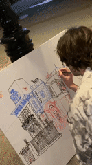 Street artist draws detailed building on canvas in Moscow