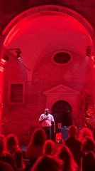 Nighttime musical performance in Venice courtyard near historic basilica