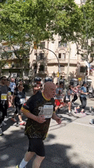 Marathon runners race through tree-lined Barcelona streets
