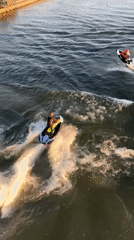 Jet skiers enjoy afternoon recreation on Krasnoyarsk river