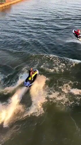 Jet skiers enjoy afternoon recreation on Krasnoyarsk river