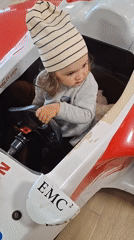 Toddler explores Toyota F1 replica at Novogorelovo showroom