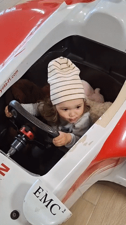 Toddler explores Toyota F1 replica at Novogorelovo showroom