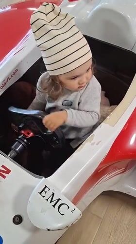 Toddler explores Toyota F1 replica at Novogorelovo showroom