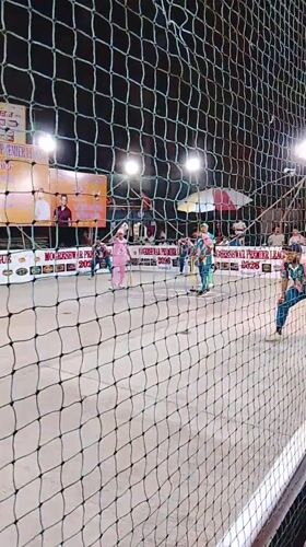 Nighttime cricket match observed in Mumbai with colorful uniforms