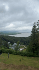 Elevated panoramic survey captures Прикамский landscape and ski jump monument