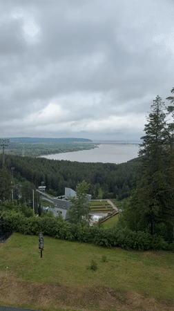 Elevated panoramic survey captures Прикамский landscape and ski jump monument