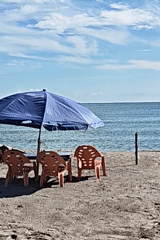 Beach chairs and umbrellas spotted on Lhokseumawe shore