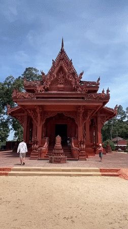 Inside and outside a red temple in Baan Hua Thanon