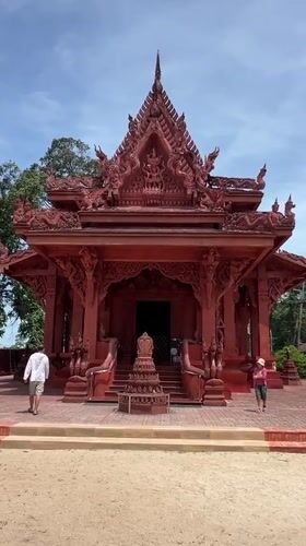 Inside and outside a red temple in Baan Hua Thanon