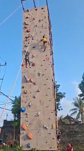 Rock climbers scale artificial wall in Blahbatuh, Indonesia