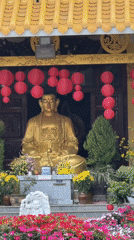 Traditional yellow temple with gold feature documented in Da Lat