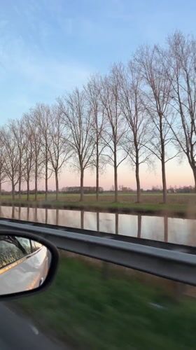 Evening drive captured along canal road in Veghel