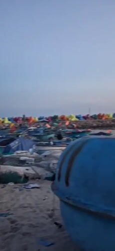 Sunset on a working beach in Phu Thuy Ward, Vietnam