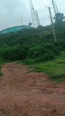 Street-level snapshot of Jos, Nigeria — roads, landmarks, and daily life