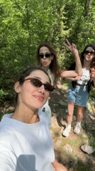 Three women take selfie on hiking trail in Montenegro