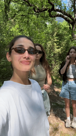 Three women take selfie on hiking trail in Montenegro