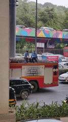 Mumbai traffic, transit, and a cosplay convention on a cloudy afternoon