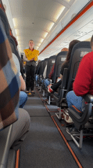 Flight attendant conducts safety demonstration on Luxembourg-area aircraft