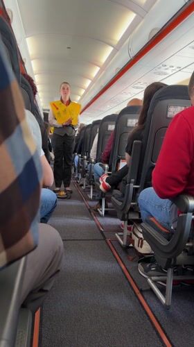 Flight attendant conducts safety demonstration on Luxembourg-area aircraft