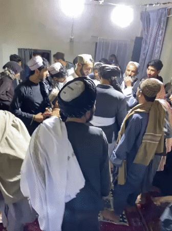 Traditional gathering with food and ceremonies in Kandahar
