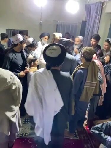 Traditional gathering with food and ceremonies in Kandahar