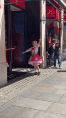 Costumed performers entertain crowds outside London's Hamleys toy store