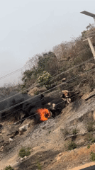 Damaged car towed, tire burns at crash scene in Jos